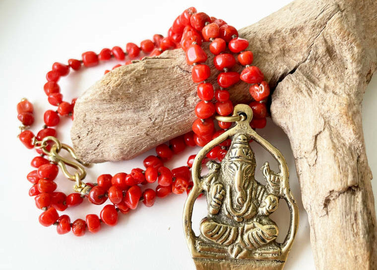 coral knotted necklace and large ganesh pendant